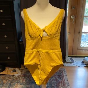 Super cute yellow one piece.